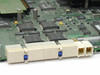 Cabletron 6E123-50 PCB close-up showing high-density backplane edge connector with blue retention clips and multiple processor ICs