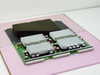 Silicon Graphics 030-0742-001 512X2 Power Module Board — top-angled view showing four large aluminum heatsinks and green PCB on antistatic foam