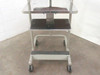Anthro rolling computer cart front view showing two main shelves and lower footrest rung with swivel casters