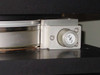 CMS PS-700 Newport linear stage close-up — precision ball-screw stage rail with stepper motor and Newport encoder/motor mount detail