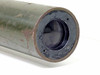 M107 autocollimator objective lens end view showing circular lens element with dark annular surround and surface wear on tube body