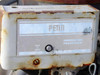Penn lubrication protection control with push-to-reset button, showing rust and wear on housing