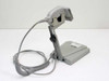 PSC Mac-Barcode GP5385-183842 handheld laser scanner on AutoSense stand – left-side view showing cable routing and base