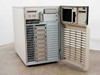 Digital AlphaServer 2100 BA740 – right side open showing multiple SCSI hard drive bays with green pull tabs, 3.5-inch floppy drive area, CD-ROM drive, and expansion slot door open