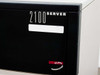 Digital AlphaServer 2100 front panel close-up – 2100 SERVER badge and ALPHA GENERATION logo on black bezel panel