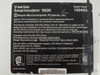 Hayes 1004AM V-Series Smartmodem 9600 bottom label showing model number, FCC registration, Part 68 compliance, serial number, CSA/ETL listing marks, and power supply rating (9V AC 800mA)