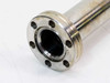 Close-up of vacuum flange end – 33mm OD six-bolt hole pattern flange with 16mm ID bore, light surface discoloration visible