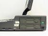 Sharp PC-4500 left side showing dual 3.5-inch floppy disk drives, brightness and contrast sliders, and green LED