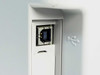 HP LaserJet 1012 — close-up of rear USB Type-B port with USB symbol icon visible on the chassis