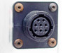 Close-up of 8-pin circular female connector receptacle — 8 socket contacts arranged in circular pattern, black plastic housing, four mounting screws