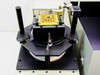 Oriel 68709 — removable center arc lamp section on optical stage showing gold-anodized lamp mount plate and adjustment hardware