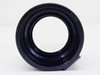 Kodak Projection Ektanar Carousel lens — straight-on rear view showing lens element and rubber mount ring
