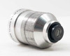 Bell & Howell 16mm Projection Lens — rear three-quarter view showing threaded aluminum barrel engraved 'BELL & HOWELL MADE IN U.S.A.' and rear optical element