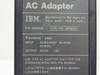 IBM 48G8291 AC Adapter label showing P/N 48G8290, FRU P/N 48G8291, input AC100-240V 40-52VA 50/60Hz, output DC15V 1.3A, for Communication Box 48G9840
