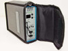TPI 108-DS1 DS1 Test Access Module fully inserted into open gray TPI soft carry case showing Velcro closure and padded interior