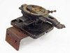 Unbranded manual X/Y cross slide stage – rear angled view showing mounting bracket, base plate holes, and rust on surfaces