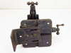 Unbranded manual X/Y cross slide stage – front view showing vertical cross-knob feed screw, side adjustment knob, and base bracket