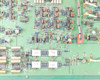 Hughes 3899311-100 internal PCB close-up — lower board section showing additional DIP ICs, ceramic capacitors, RF components, and connector J5