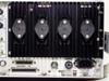 Microdyne 1400-MR rear panel right section showing four power transistors U1–U4 on heatsink, RS-232 connector J26, Accessory port J20, and IEC AC power inlet rated 115/230 VAC 50-400 Hz