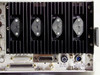 Microdyne 1400-MR rear panel power section showing large black finned heatsink with power transistors, RS-232 port J2G, accessory port J2C, 1.5A SLC-BLC fuse, and 120V AC 50–60 Hz power inlet
