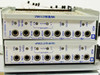 Wescom 401 Wire Line Amplifier modules front panel closeup showing RCV, XMT, LEVEL, EQUAL, HF, LF, LINE, DROP, MON jacks and RACOM patch points — two units stacked