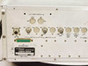 Microdyne 1100-AR rear panel left section showing BNC RF IN (J2), 1ST LC and 2ND LC jacks, REF CSC CUT, PRE-D connectors, 10 MHz output, JI Accessories D-sub connector, and identification label