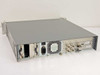 ComStream CM701 rear panel overview showing IEC AC inlet, cooling fan, BNC RF connectors, DB9 serial ports, and expansion card bay