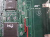 Intel i386SX CPU chip closeup on AST Research 202438 processor board — AST logo and P/N 202438 silkscreen visible