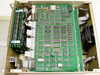 Hughes 3814100-100 interior – top-down view of main PCB (AS ASSY 3814102 REV F) with internal boards, ribbon cables, and cooling fan