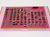 Varian 01002543-00 Control Logic Board Rev M — rear side showing solder side of pink PCB with gold edge connector