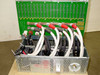General Instrument CLI Magnitude MPEG Encoder — rear view of power supply and backplane showing multi-cable harness, power supply unit, and PCB connector rows