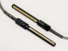 Close-up of both Dynatech 12-pin pogo pin connectors side by side showing gold spring contacts and black plastic housings