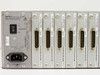 Cybex Commander 4XP rear panel close-up showing power switch, 100–240V IEC inlet, and seven XPAC 600-170 REV L modules