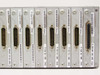 Cybex Commander 4XP module close-up showing individual XPAC 600-170 REV L modules and one XPDU 600-233-002 REV F module with high-density connectors