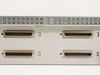 HP J2602A AdvanceStack front panel close-up showing four DB-44 ThinLAN segment connectors with port numbering strips for segments A, B, C, and D