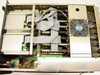 Cubix LCS Resource SubSystem interior view showing 8 TEAC floppy drives with ribbon cable connections, internal controller boards, and rear cooling fan