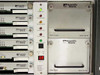 Scientific Atlanta D-9110 PowerVu Digital Multiplexer – right side panel showing alarm status indicators, unit ID display, Supply 1/2 indicators, and two D9709 Power Supply modules