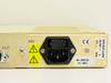 STS D61486-01 product label close-up reading SERL/SUM ALARM D61486-1 Rev E, date code 9649, with AC1 IEC inlet and CE marking
