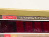 Keithley 177 Microvolt DMM nameplate close-up reading '177 MICROVOLT DMM' with Keithley logo and LED display filter visible