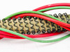 Close-up of Titan Industrial heating element coiled resistance wire construction with ceramic refractory body and red and green wire leads