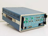 Tau-Tron S5104 rear panel view — Monitor outputs (green BNC), NRZ inputs, receiver inputs, power inlet, and large DB connector visible