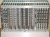 CLI Magnitude rear card cage panel showing rows of BNC, DB-25, and other connectors across all installed modules, numbered slot positions visible