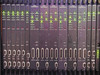 CLI Magnitude front panel close-up showing Audio and Video Compressor module faceplates with green/red LED status indicators and RESET/TEST/MONITOR controls
