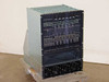 CLI Compression Labs Magnitude MPEG-2 DVB satcom multiplexer chassis — three-quarter front-left view showing full populated card cage on pallet