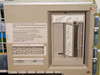 DEC TK70 streaming tape drive front panel with cartridge slot and multilingual removal warning label, installed in BA213 chassis