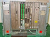 DEC BA213 card cage front view showing all installed modules with backplane connectors, ribbon cables, and dual H7868 power supplies