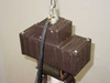 Lumark HID fixture ballast housing top view — dual ballast cans with pendant mount hook and supply wiring