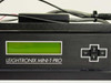 Leightronix Mini-T-Pro front panel close-up showing green LCD display and 4-way directional navigation buttons