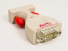 APC PS9-DTE ProtectNet RS-232 DTE serial port surge protector — angled front view showing DB9 male connector and red thumbscrews