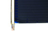 Corner detail of Uni-Solar L-Strip solar cell showing amorphous silicon surface, edge blemish, and aluminum frame construction